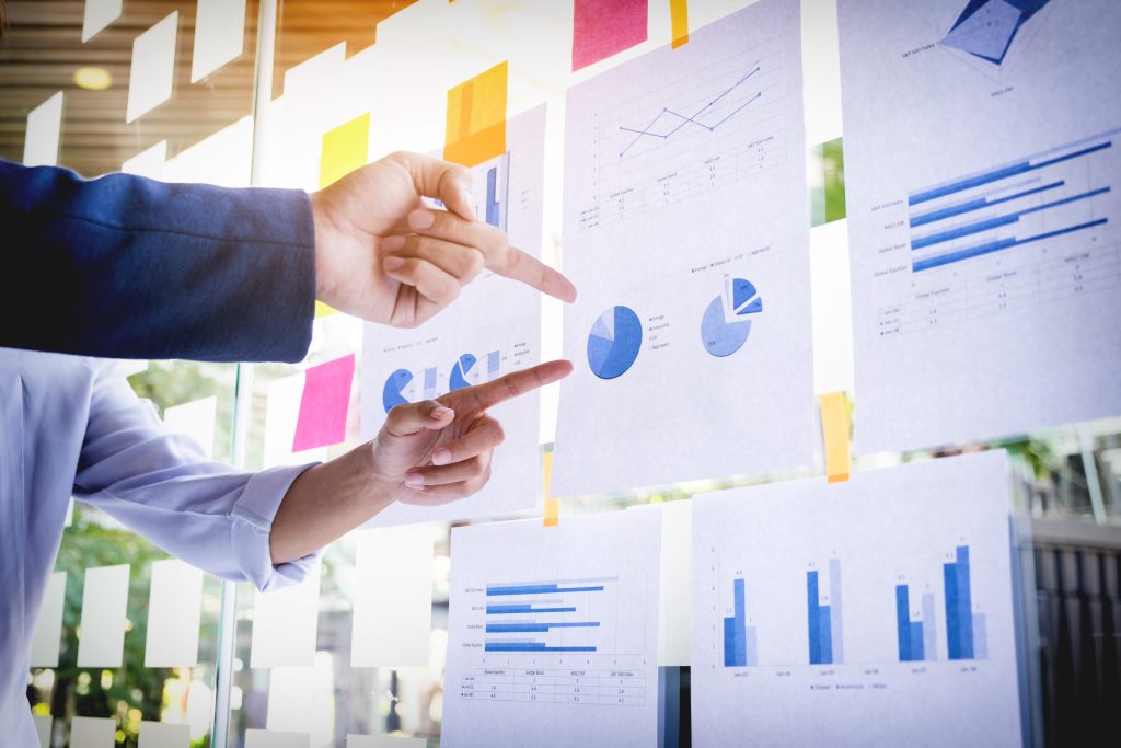 Businessman making presentation with his colleagues and business